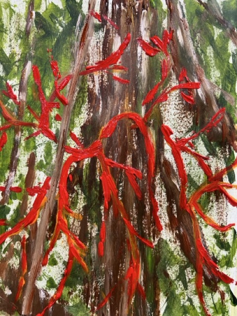 trunk of a tree with red streaks over it